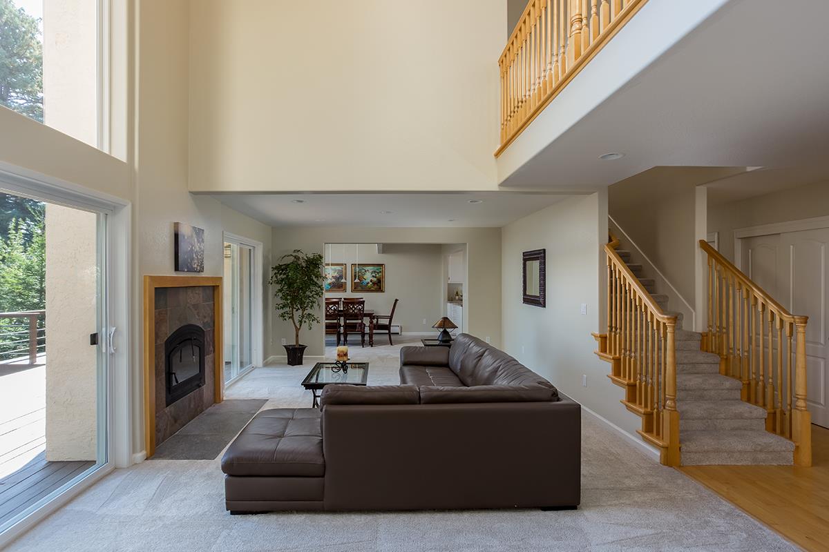 377 Rider Ridge Road Santa Cruz, CA 95065 - Photo 5 of 25 a living room with furniture and a fireplace