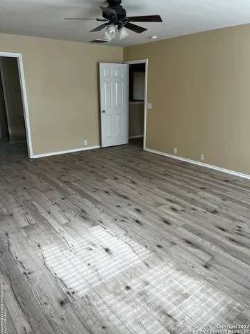 a view of a livingroom with wooden floor