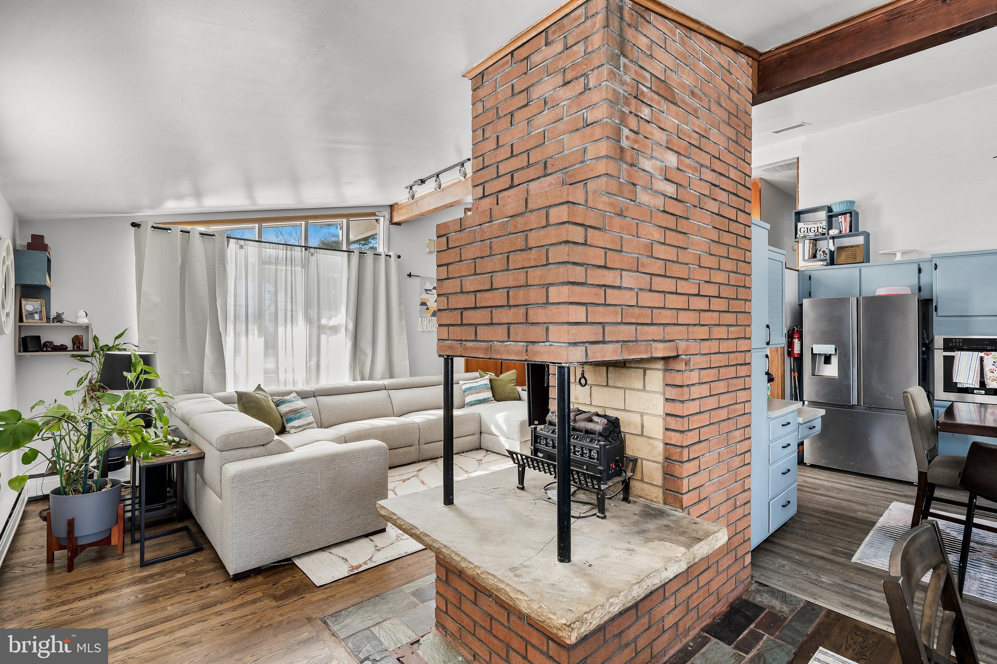 418 Sherry Way Cherry Hill, NJ 08034 - Photo 17 of 42 a living room with couches and a dining table with wooden floor