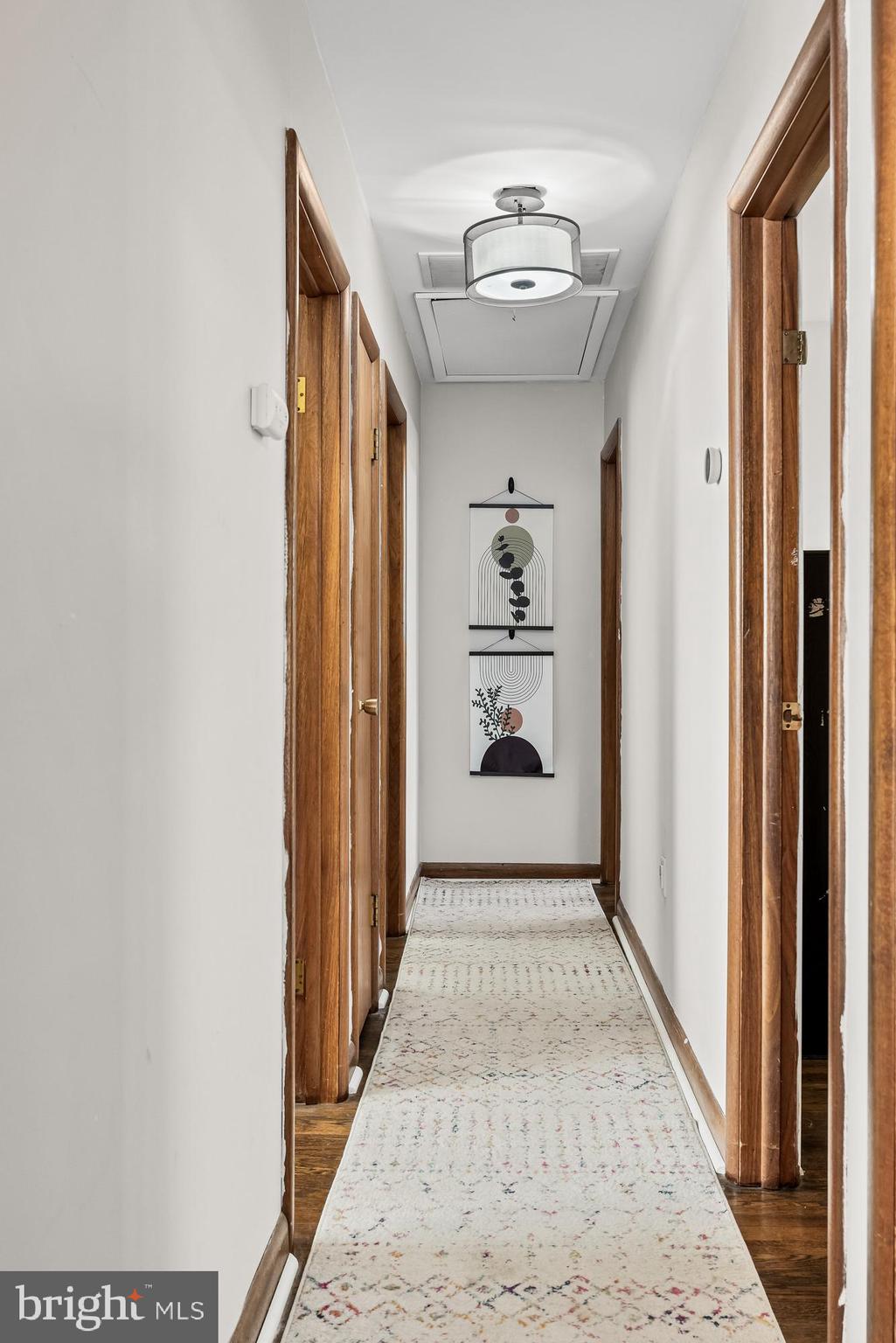 418 Sherry Way Cherry Hill, NJ 08034 - Photo 26 of 42 a view of hallway with a window and wooden floor