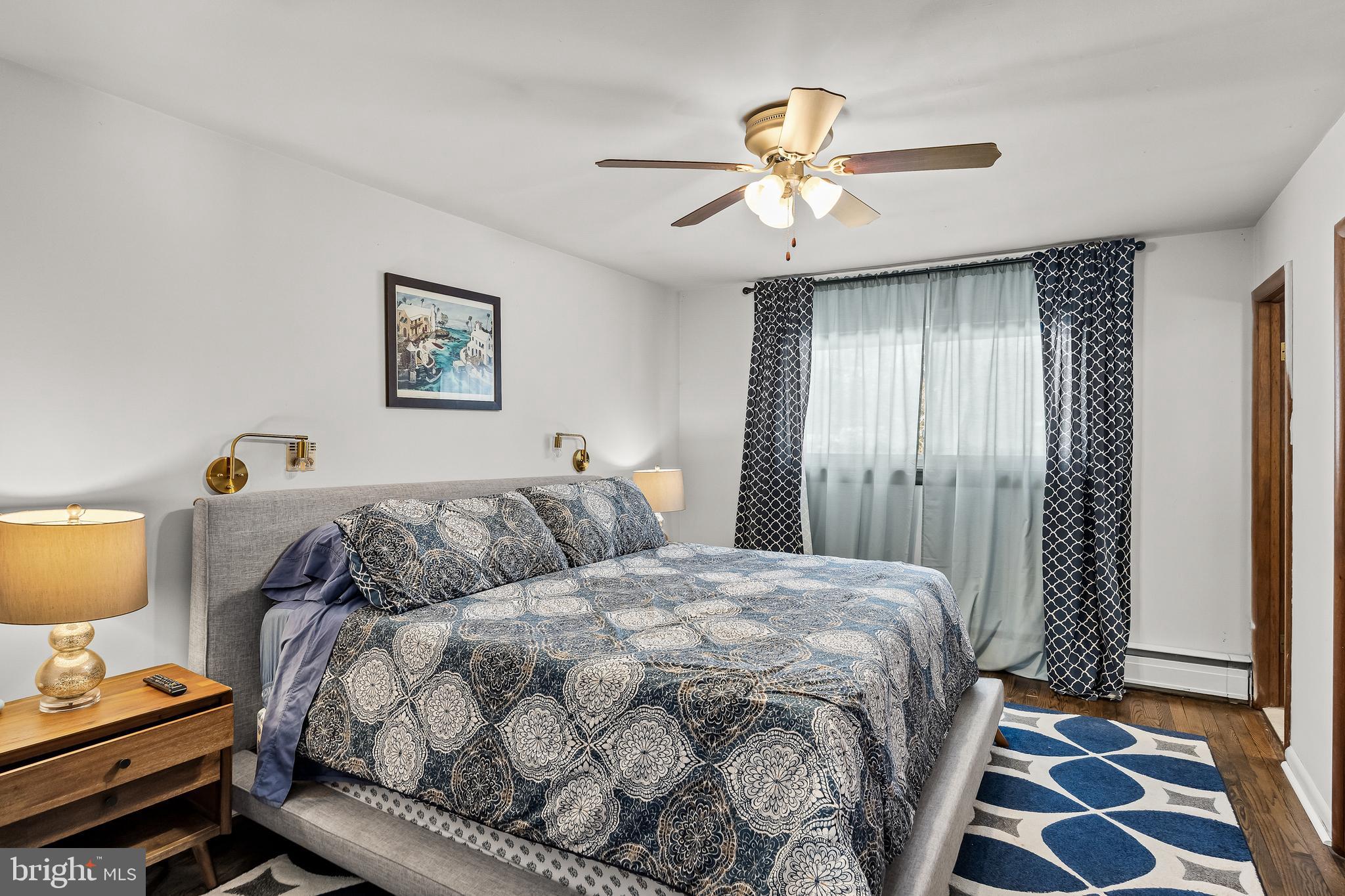 418 Sherry Way Cherry Hill, NJ 08034 - Photo 27 of 42 a bedroom with a bed and a chandelier