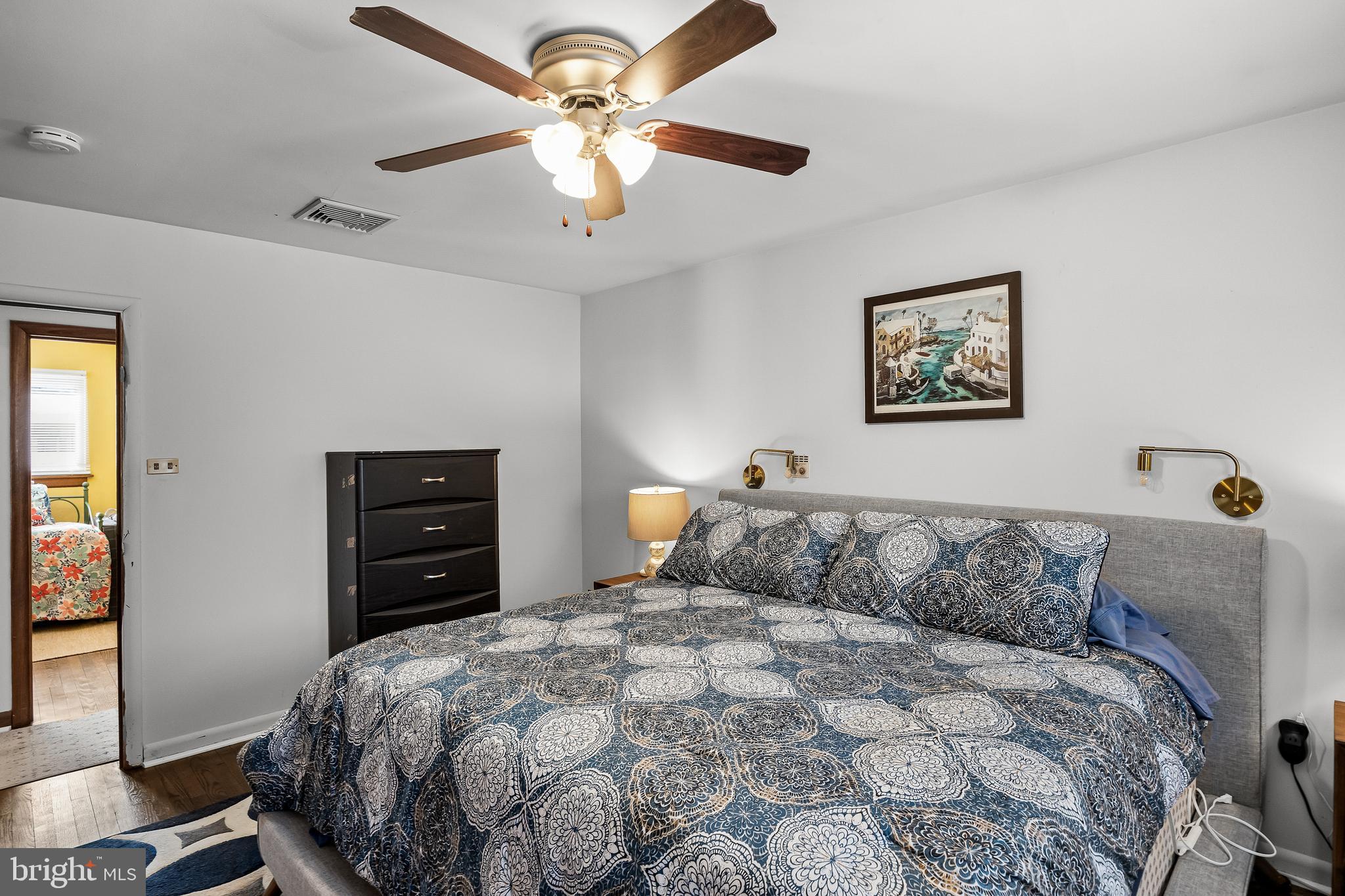 418 Sherry Way Cherry Hill, NJ 08034 - Photo 28 of 42 a bedroom with a bed and a chandelier