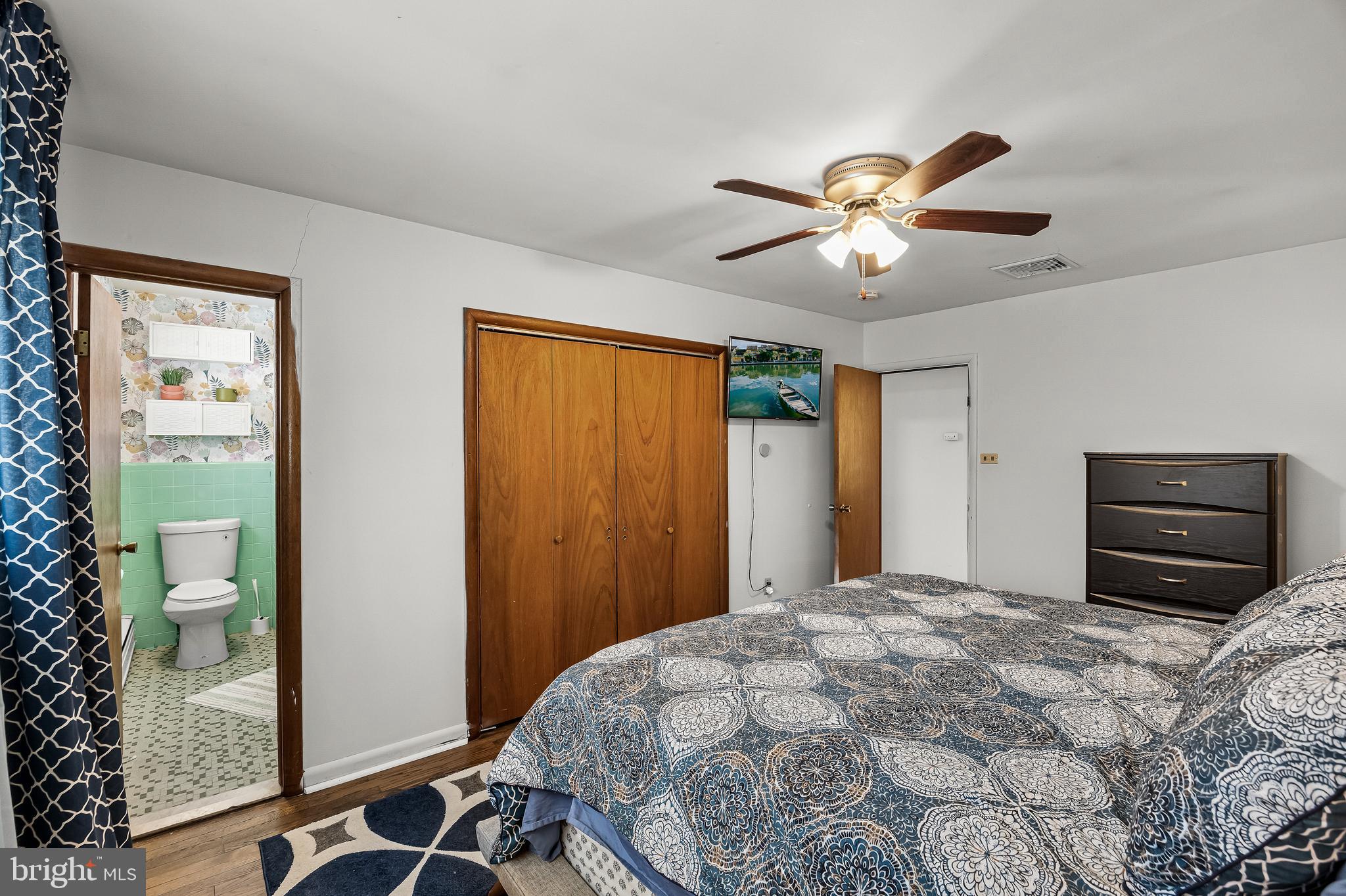 418 Sherry Way Cherry Hill, NJ 08034 - Photo 29 of 42 a bedroom with a bed and a chandelier