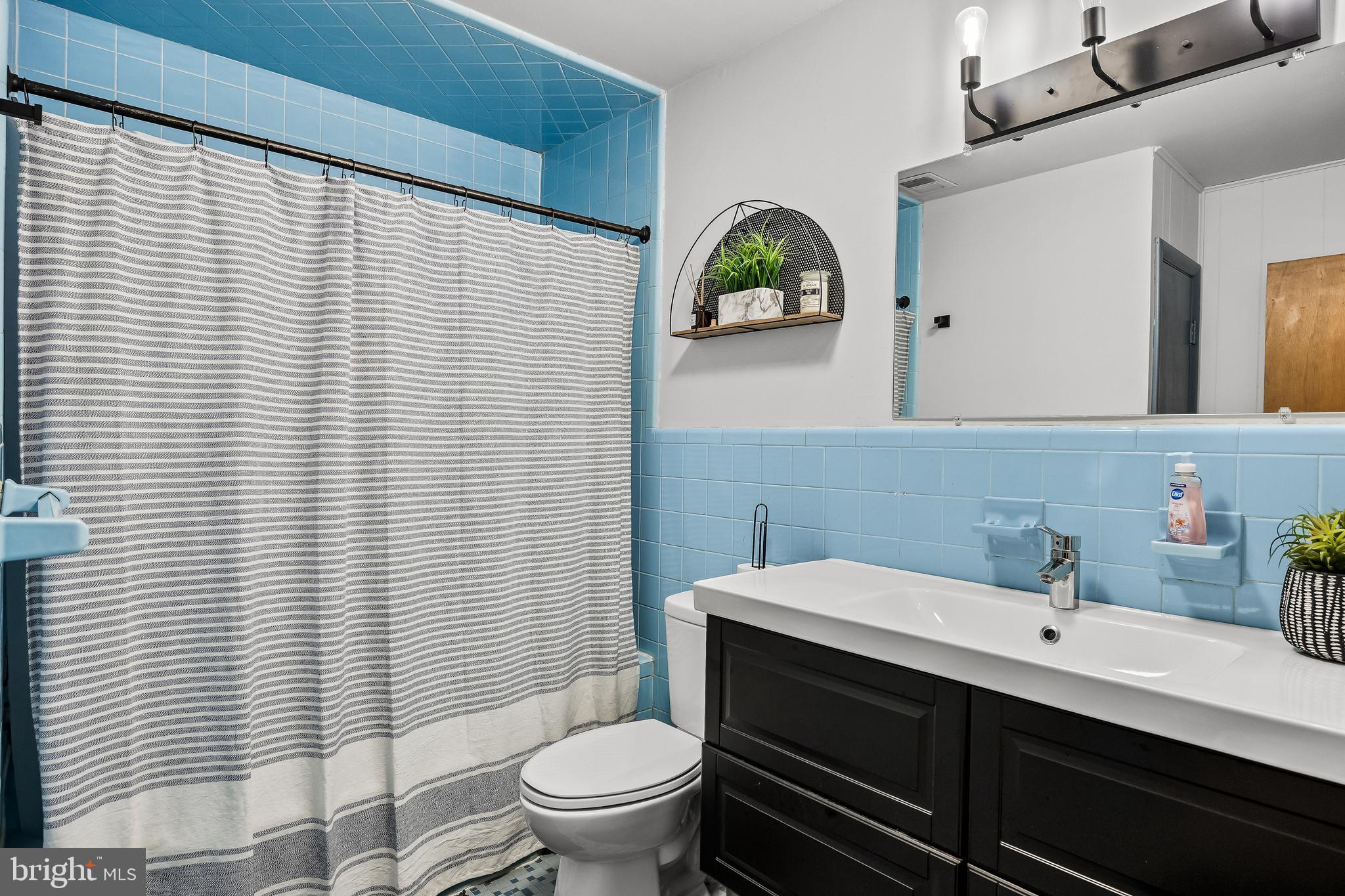 418 Sherry Way Cherry Hill, NJ 08034 - Photo 35 of 42 a bathroom with a sink a toilet and mirror