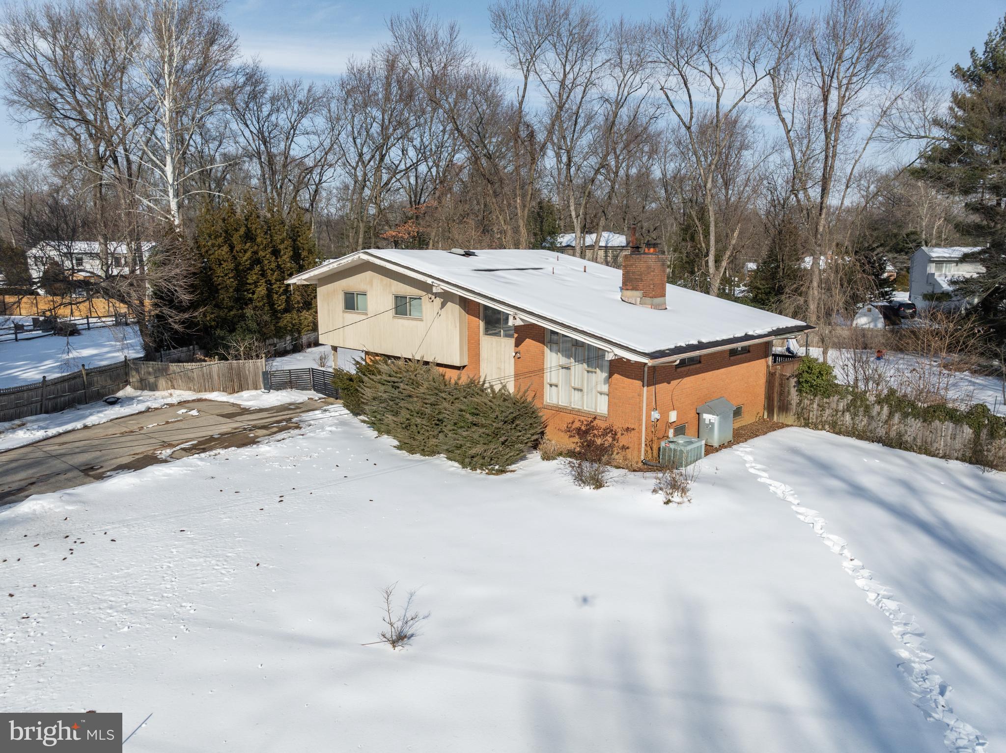 418 Sherry Way Cherry Hill, NJ 08034 - Photo 4 of 42 a view of a house with a yard covered in snow