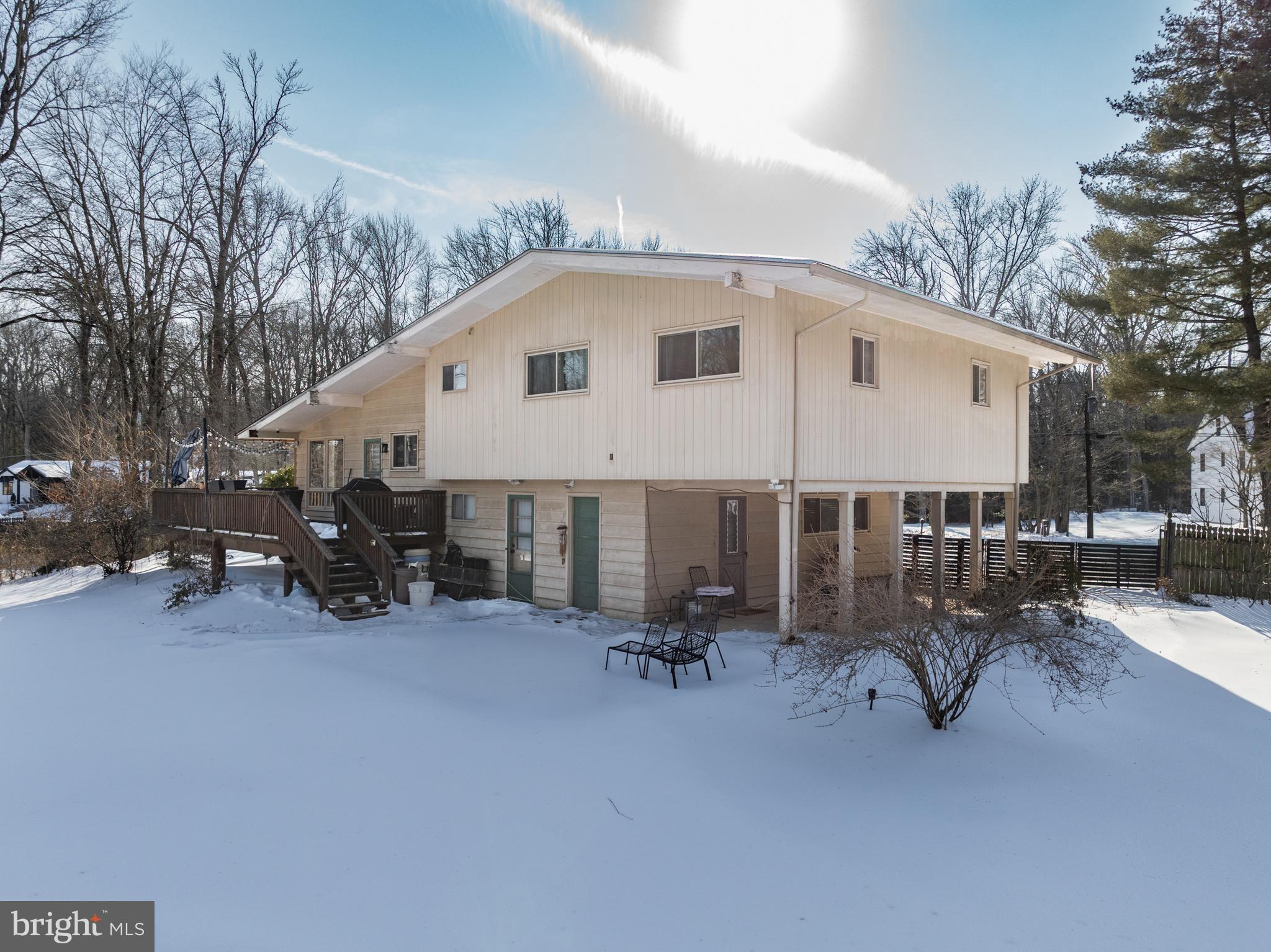 418 Sherry Way Cherry Hill, NJ 08034 - Photo 42 of 42 a view of a patio with table and chairs under an umbrella