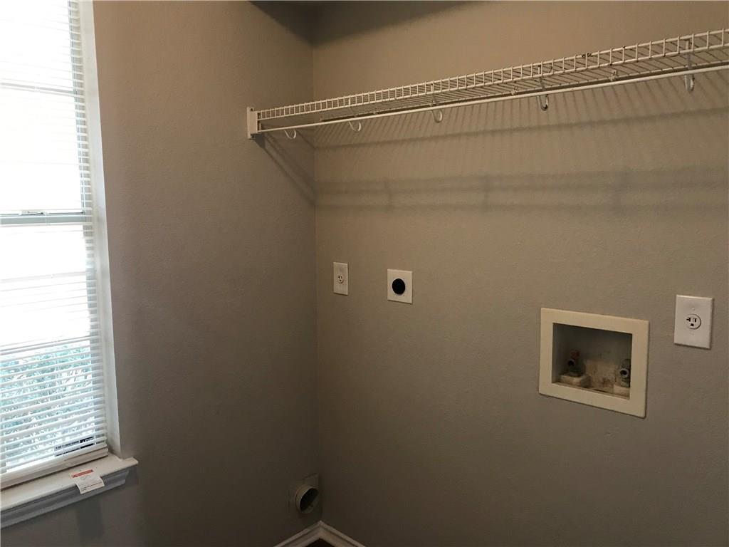 1251 Pine Portage Loop Leander, TX 78641 - Photo 16 of 17 a bathroom with a shower and a window