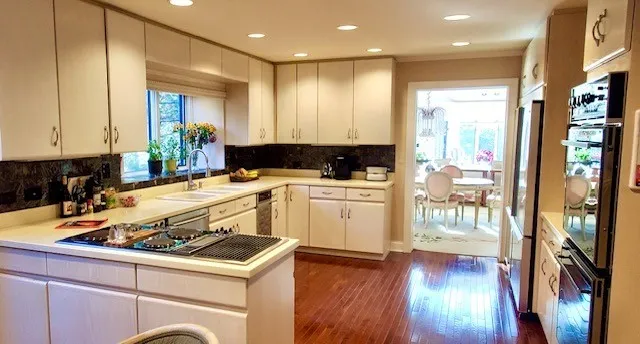 a bathroom with a sink toilet and a mirror