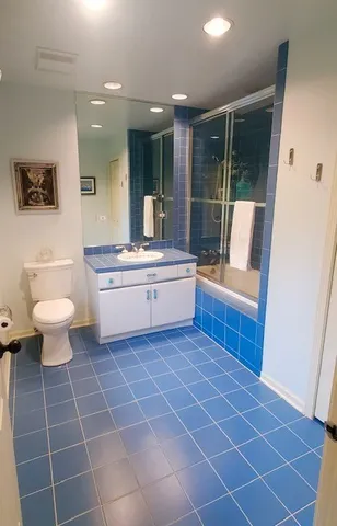 a living room with a black white checkered floor