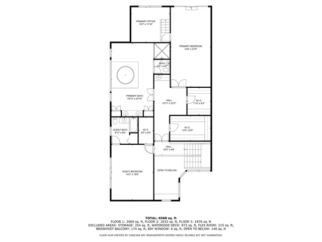 an aerial view of a house with garden space and lake view