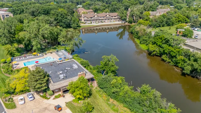 an aerial view of residential house with outdoor space and lake view