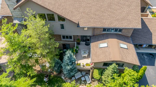 an aerial view of a house with a yard