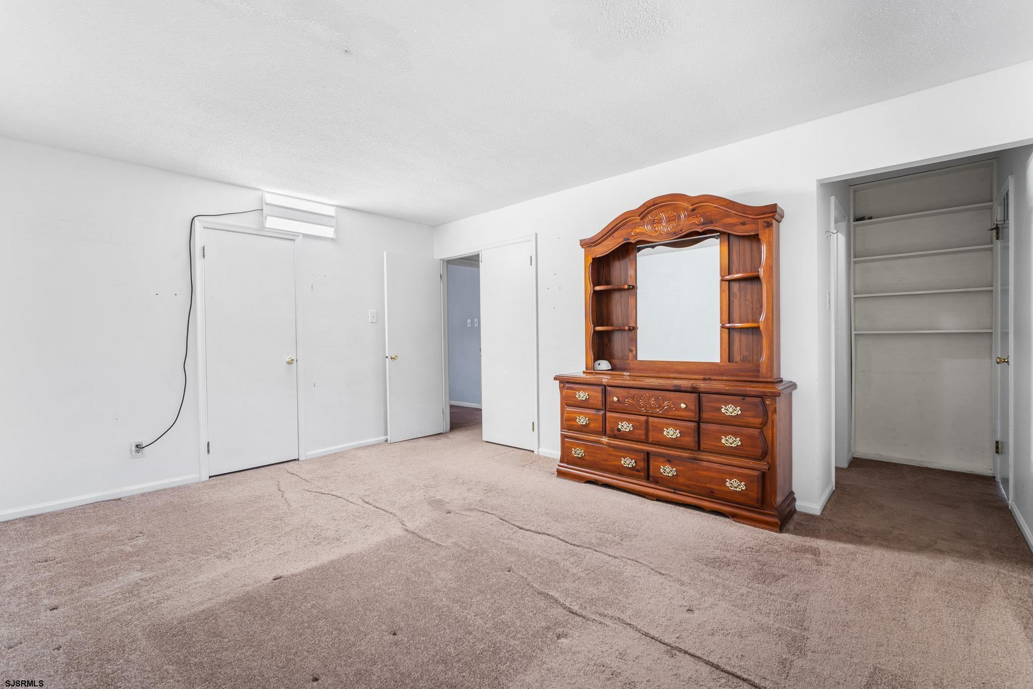 718 Cardinal Way Galloway Township, NJ 08205 - Photo 15 of 25 an empty room with windows and cabinet