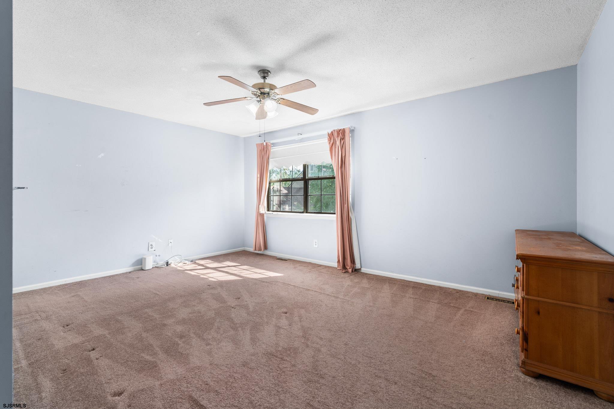 718 Cardinal Way Galloway Township, NJ 08205 - Photo 19 of 25 a view of an empty room with a window