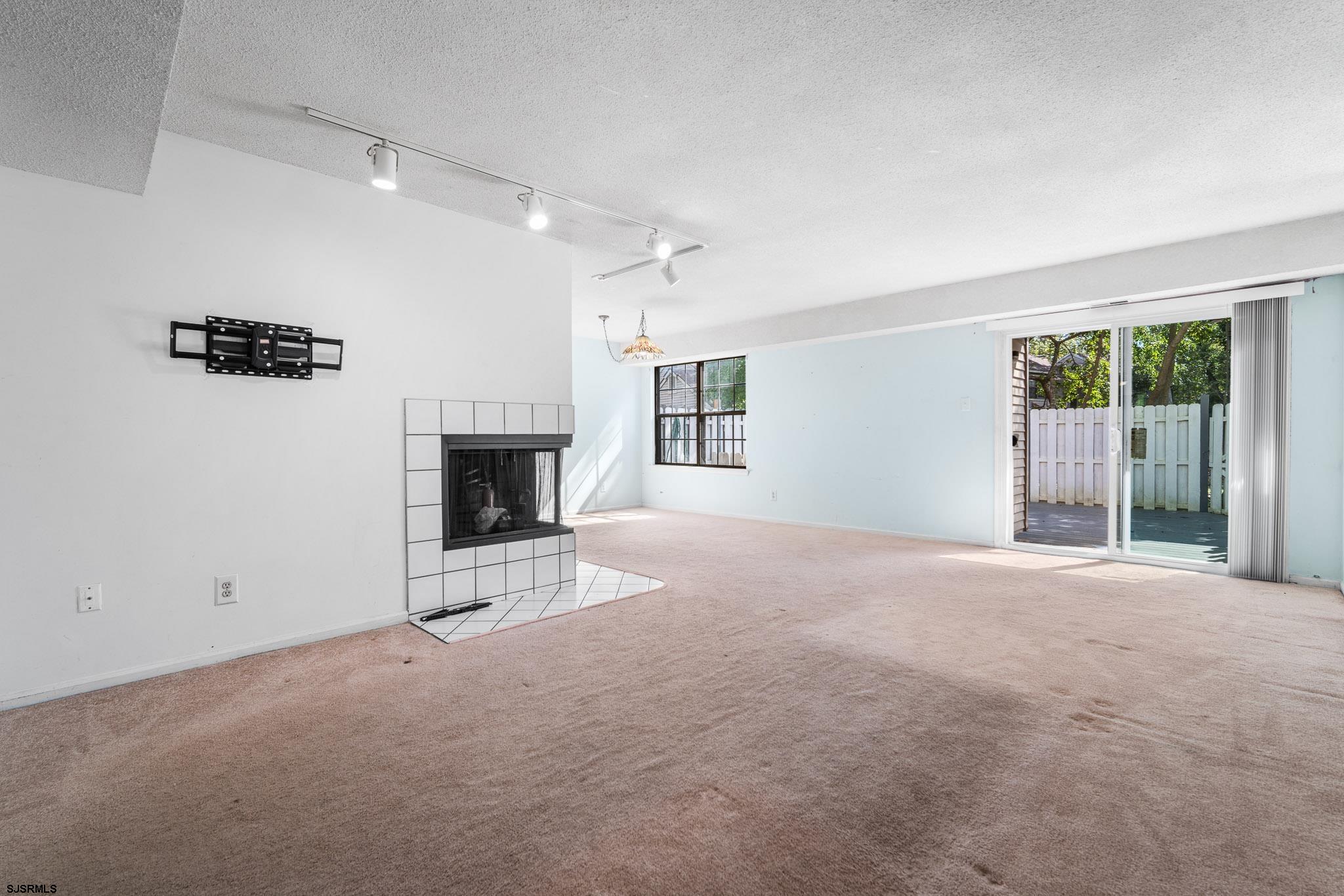 718 Cardinal Way Galloway Township, NJ 08205 - Photo 2 of 25 a view of empty room with a fireplace