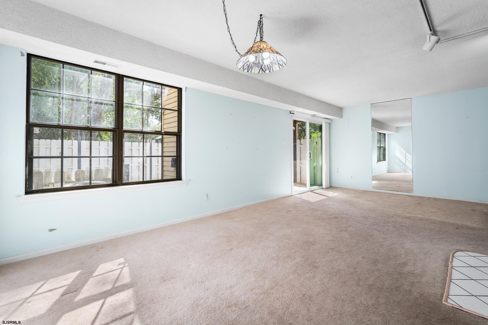 718 Cardinal Way Galloway Township, NJ 08205 - Photo 7 of 25 a view of an empty room with a window