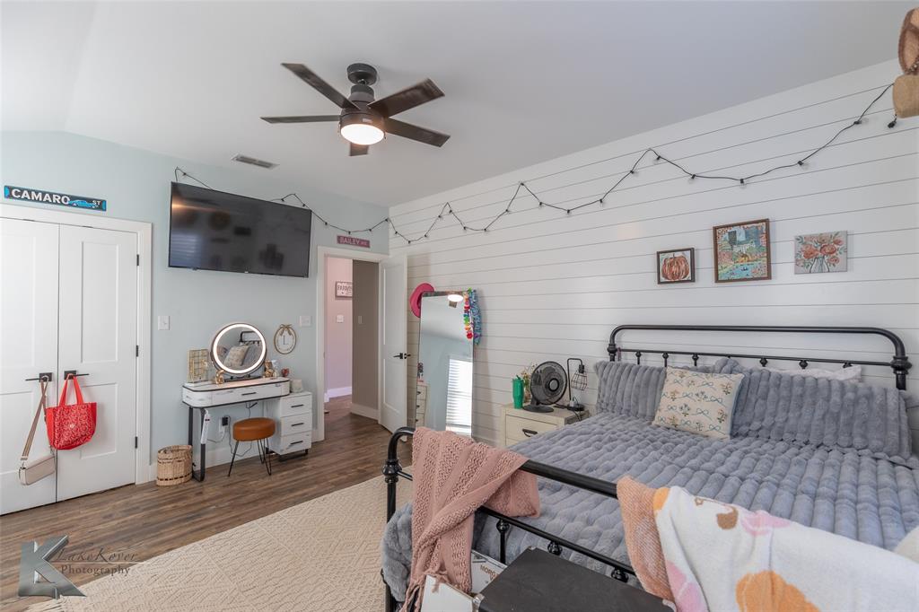684 Taylor Ridge Estates Road Abilene, TX 79603 - Photo 21 of 39 a living room with furniture and a flat screen tv
