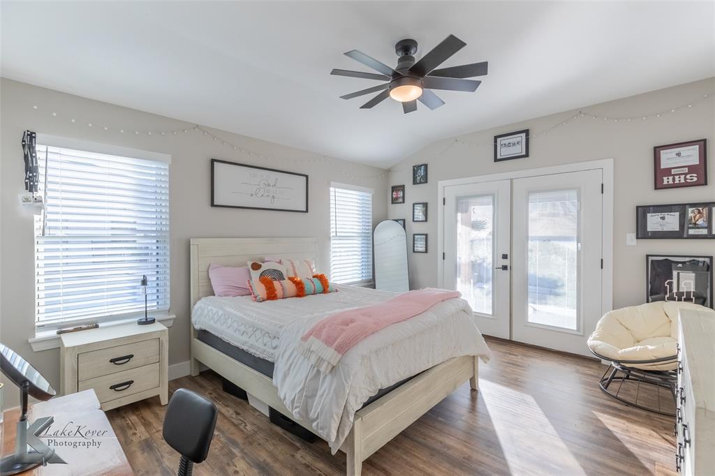 684 Taylor Ridge Estates Road Abilene, TX 79603 - Photo 25 of 39 a bedroom with a bed and furniture