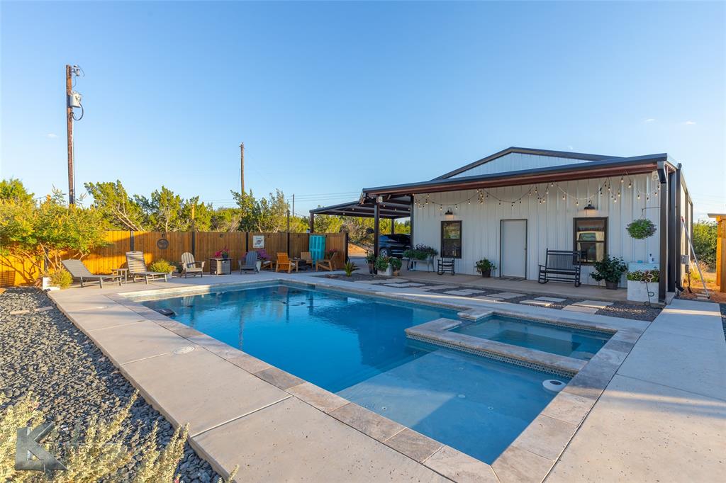 684 Taylor Ridge Estates Road Abilene, TX 79603 - Photo 28 of 39 a view of a house with swimming pool and sitting area