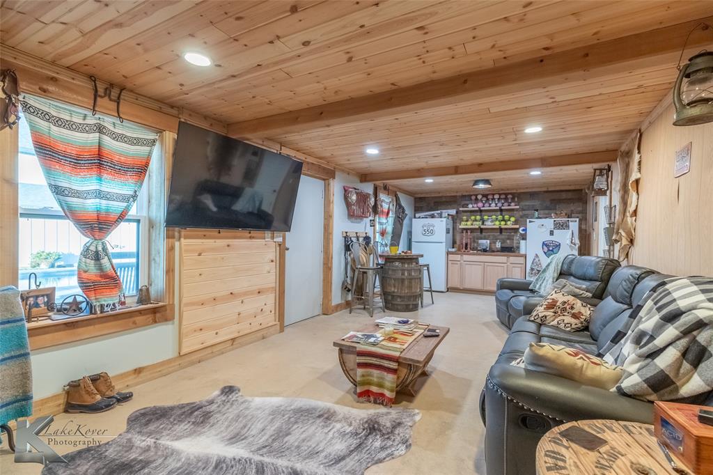684 Taylor Ridge Estates Road Abilene, TX 79603 - Photo 30 of 39 a living room with furniture and a flat screen tv