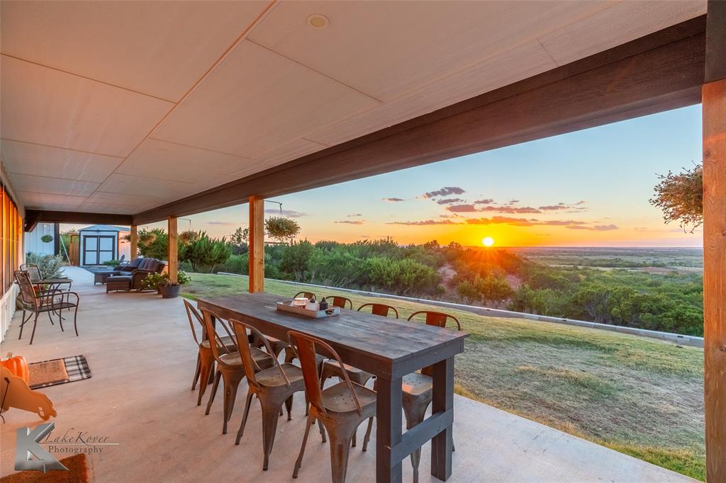 684 Taylor Ridge Estates Road Abilene, TX 79603 - Photo 34 of 39 a view of a table and chairs in patio
