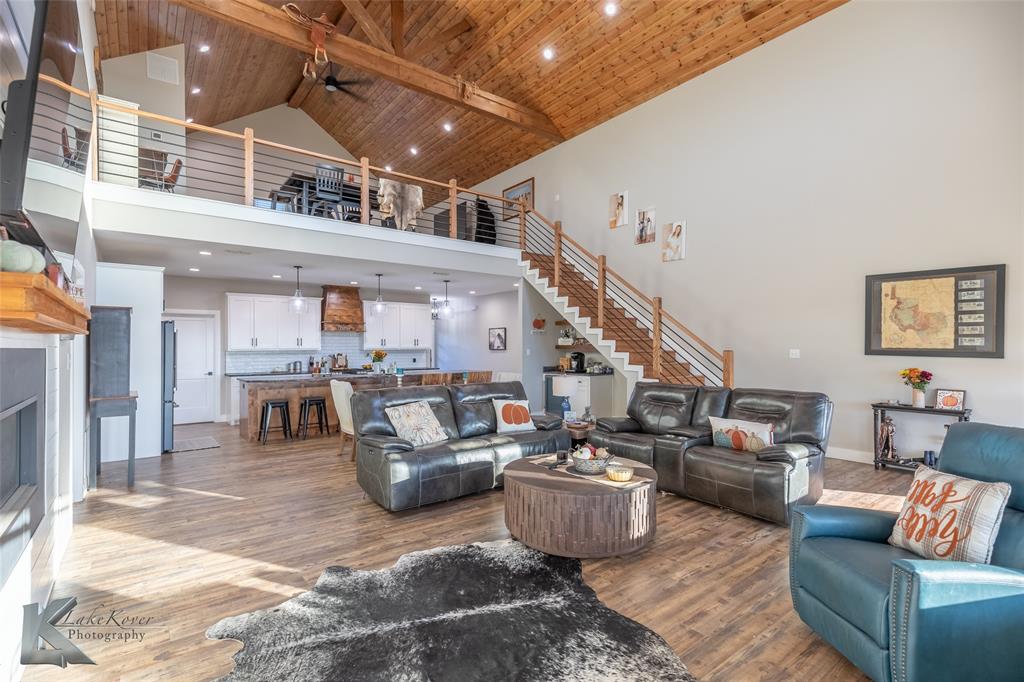 684 Taylor Ridge Estates Road Abilene, TX 79603 - Photo 6 of 39 a living room with furniture and a chandelier