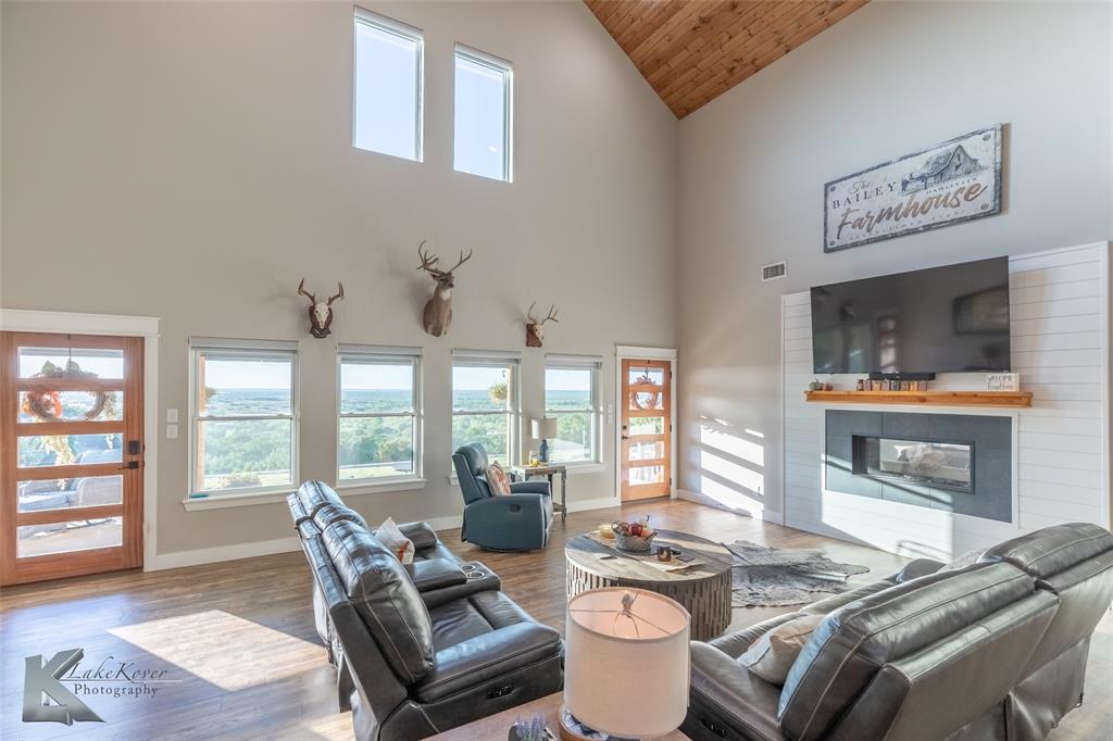 684 Taylor Ridge Estates Road Abilene, TX 79603 - Photo 7 of 39 a living room with furniture and floor to ceiling windows