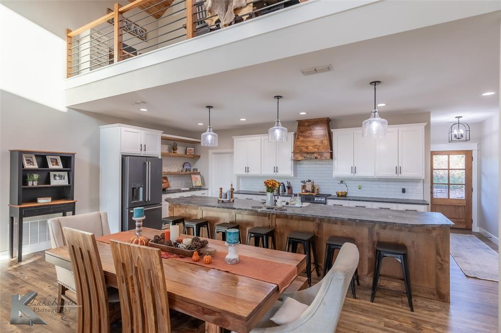 684 Taylor Ridge Estates Road Abilene, TX 79603 - Photo 8 of 39 a dining table with chairs and wooden floor