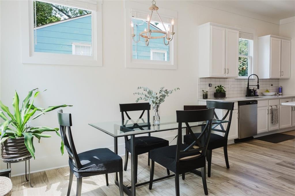 330 Mount Zion Road Southwest Hapeville, GA 30354 - Photo 12 of 41 a view of a dining room with furniture and wooden floor