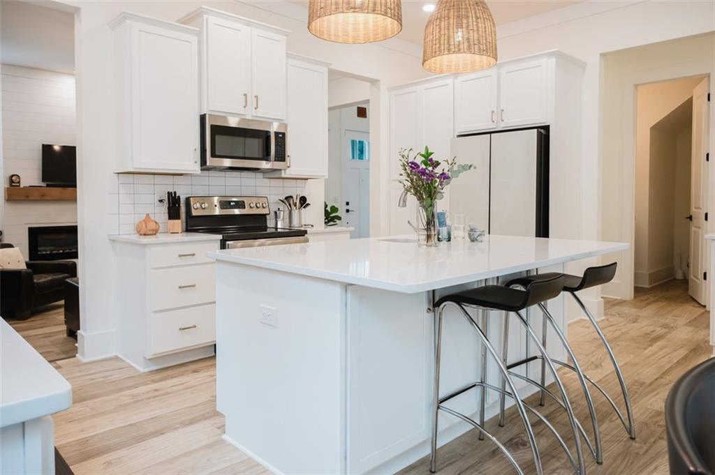 330 Mount Zion Road Southwest Hapeville, GA 30354 - Photo 16 of 41 a kitchen with a sink microwave and cabinets