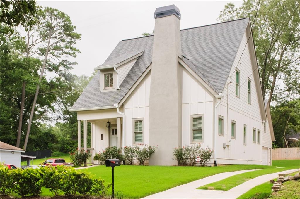 330 Mount Zion Road Southwest Hapeville, GA 30354 - Photo 3 of 41 a front view of a house with garden