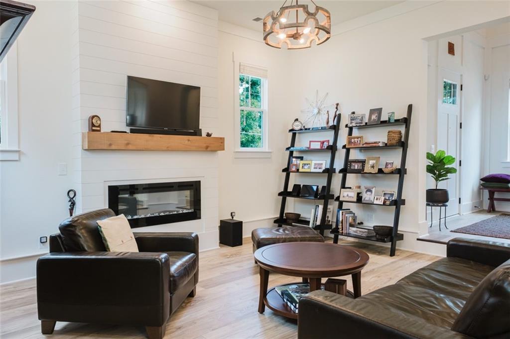 330 Mount Zion Road Southwest Hapeville, GA 30354 - Photo 10 of 41 a living room with furniture a flat screen tv and a fireplace