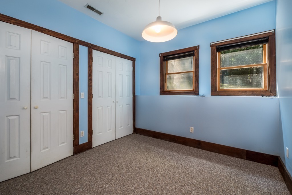 88 Fiskdale Road Brookfield, MA 01506 - Photo 19 of 30 an empty room with windows and closet
