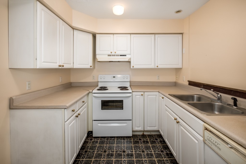 88 Fiskdale Road Brookfield, MA 01506 - Photo 20 of 30 a kitchen with a sink stove top oven and cabinets