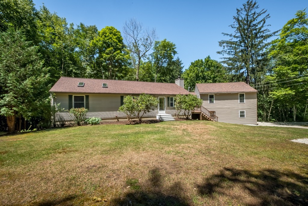 88 Fiskdale Road Brookfield, MA 01506 - Photo 2 of 30 a front view of a house with garden