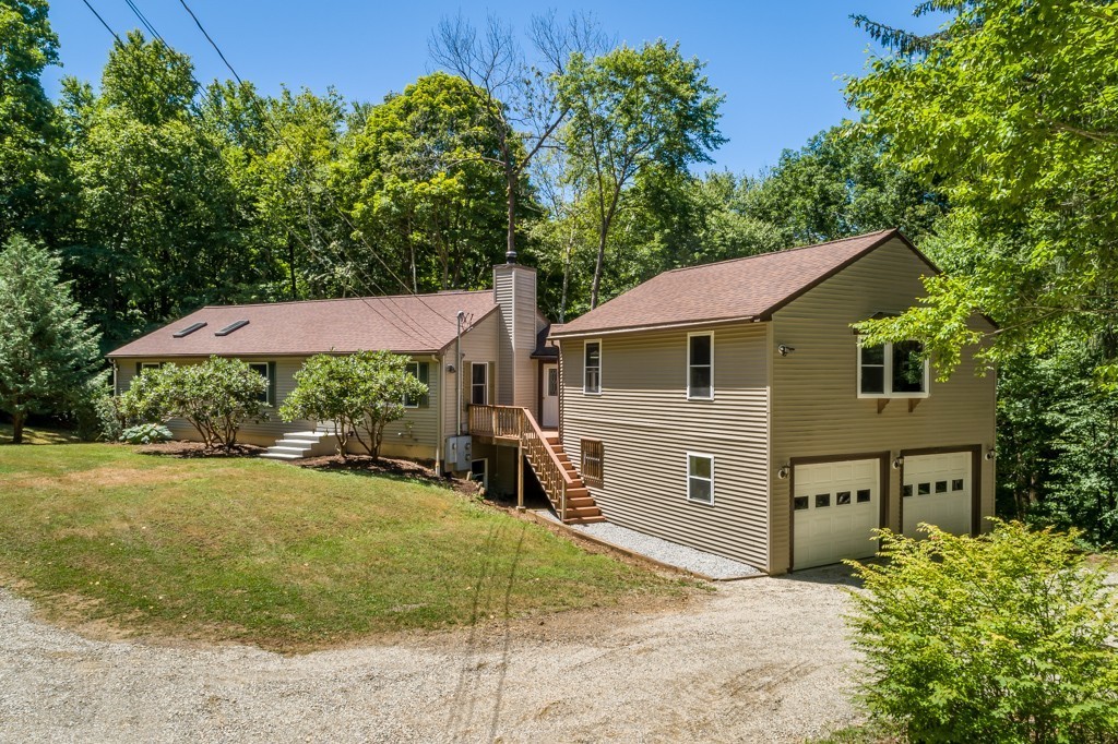 88 Fiskdale Road Brookfield, MA 01506 - Photo 3 of 30 a view of a house with backyard and a tree