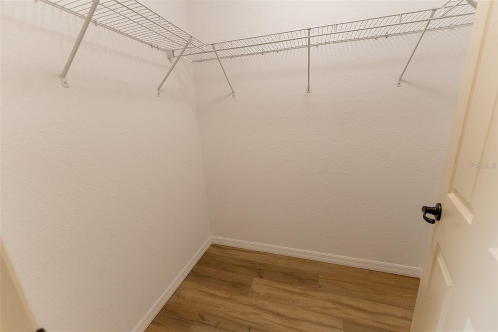 13060 Southwest 83rd Terrace Road Ocala, FL 34473 - Photo 18 of 42 a view of a room with racks on the wall