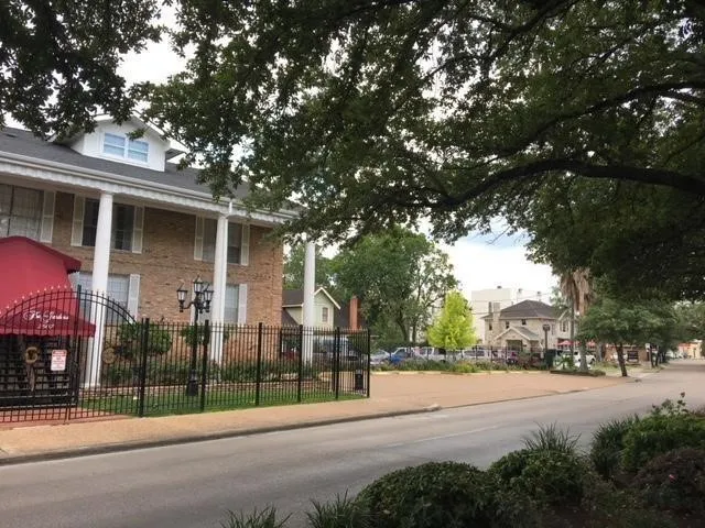 a view of road with a building in the background