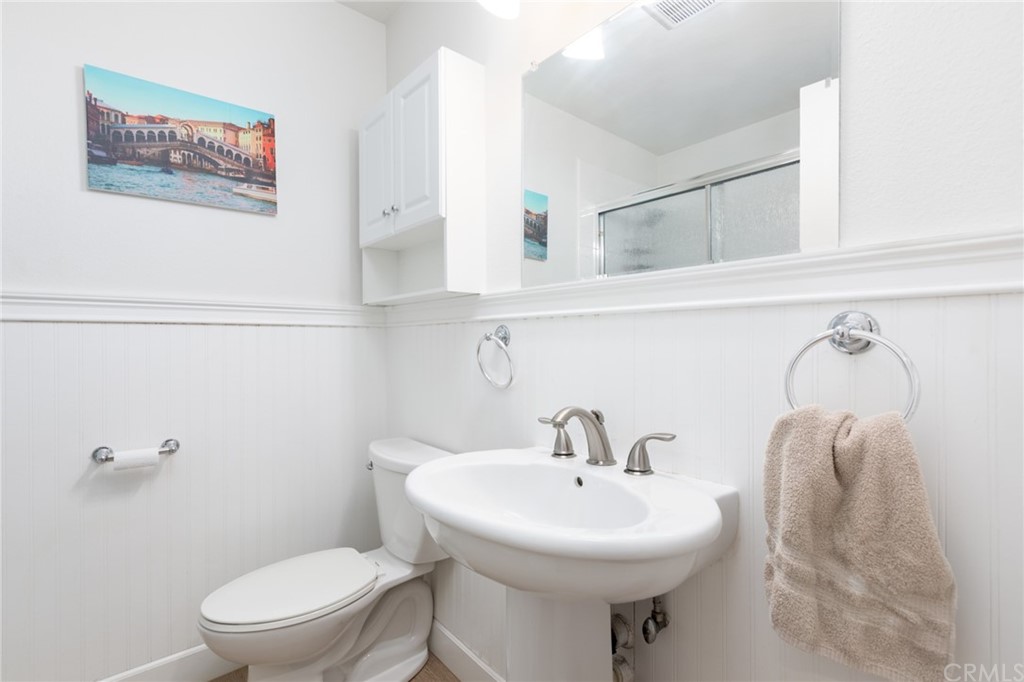 484 Traverse Drive Costa Mesa, CA 92626 - Photo 13 of 17 a bathroom with a sink mirror and toilet