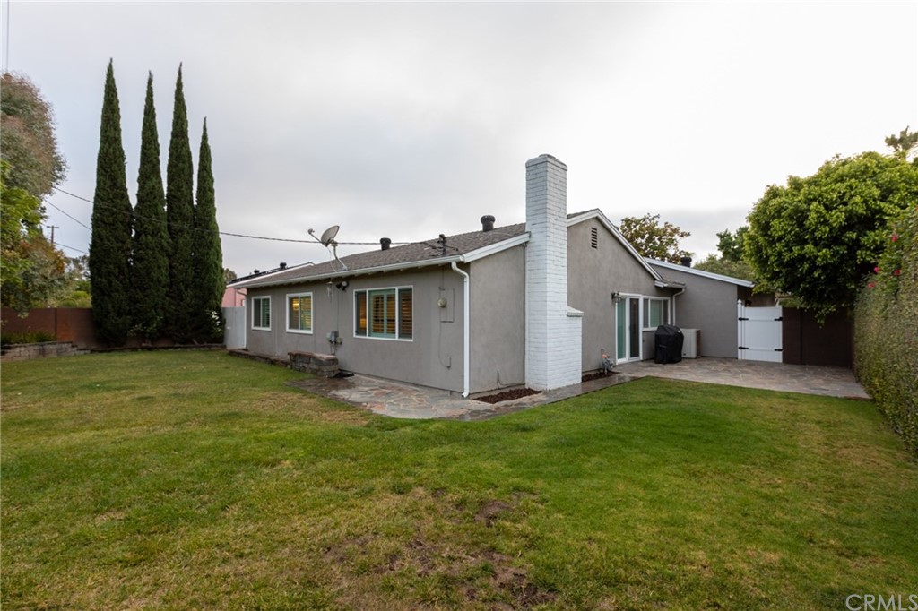 484 Traverse Drive Costa Mesa, CA 92626 - Photo 17 of 17 a view of a yard in front of a house with a large tree