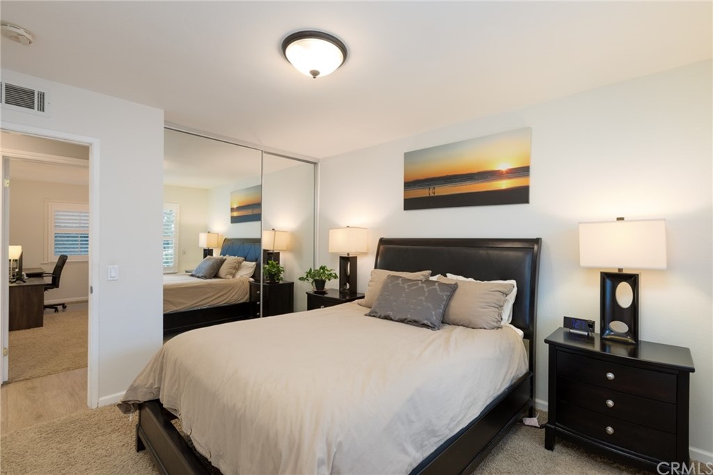 484 Traverse Drive Costa Mesa, CA 92626 - Photo 8 of 17 a bedroom with a bed and a lamp