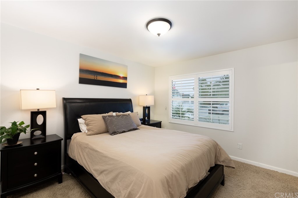 484 Traverse Drive Costa Mesa, CA 92626 - Photo 9 of 17 a bedroom with a bed and a night stand