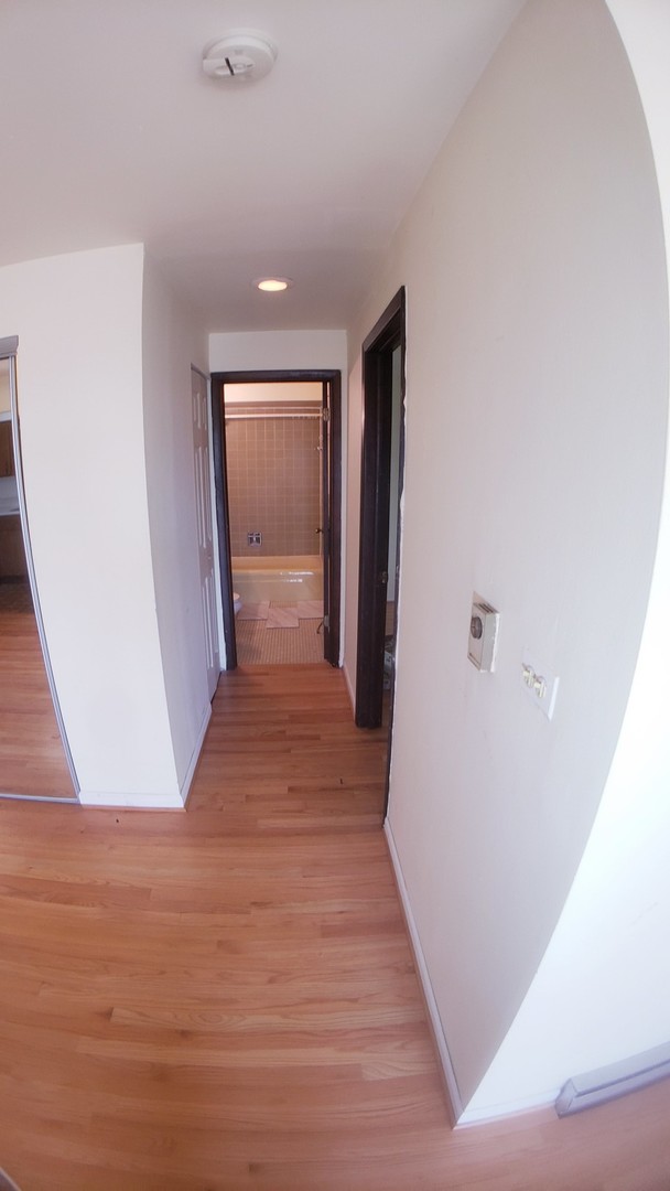 336 Lathrop Avenue, Unit 306 Forest Park, IL 60130 - Photo 20 of 42 a view of a hallway with wooden floor