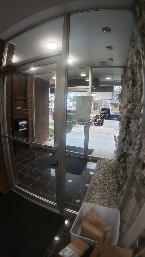 336 Lathrop Avenue, Unit 306 Forest Park, IL 60130 - Photo 4 of 42 a lobby with furniture and a glass door