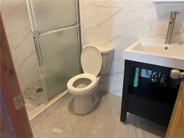 a bathroom with a toilet and a sink