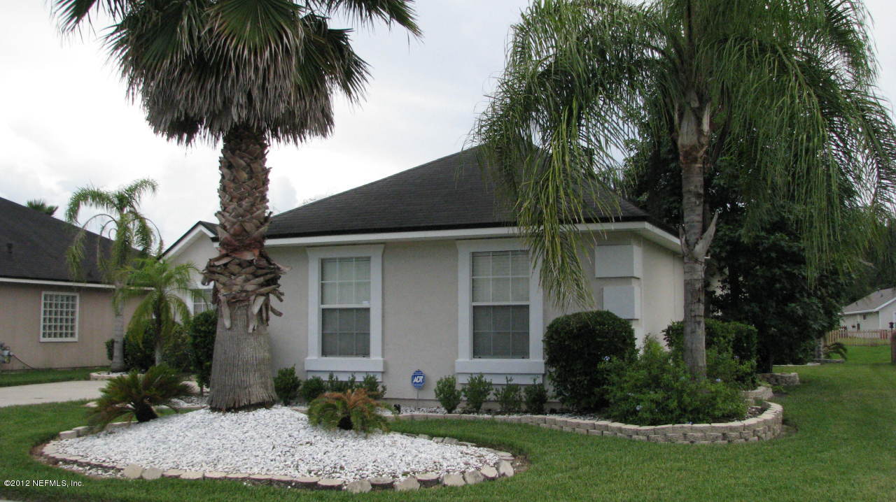 4152 East Ripken Jacksonville, FL 32224 - Photo 14 of 14 a front view of house with yard and green space