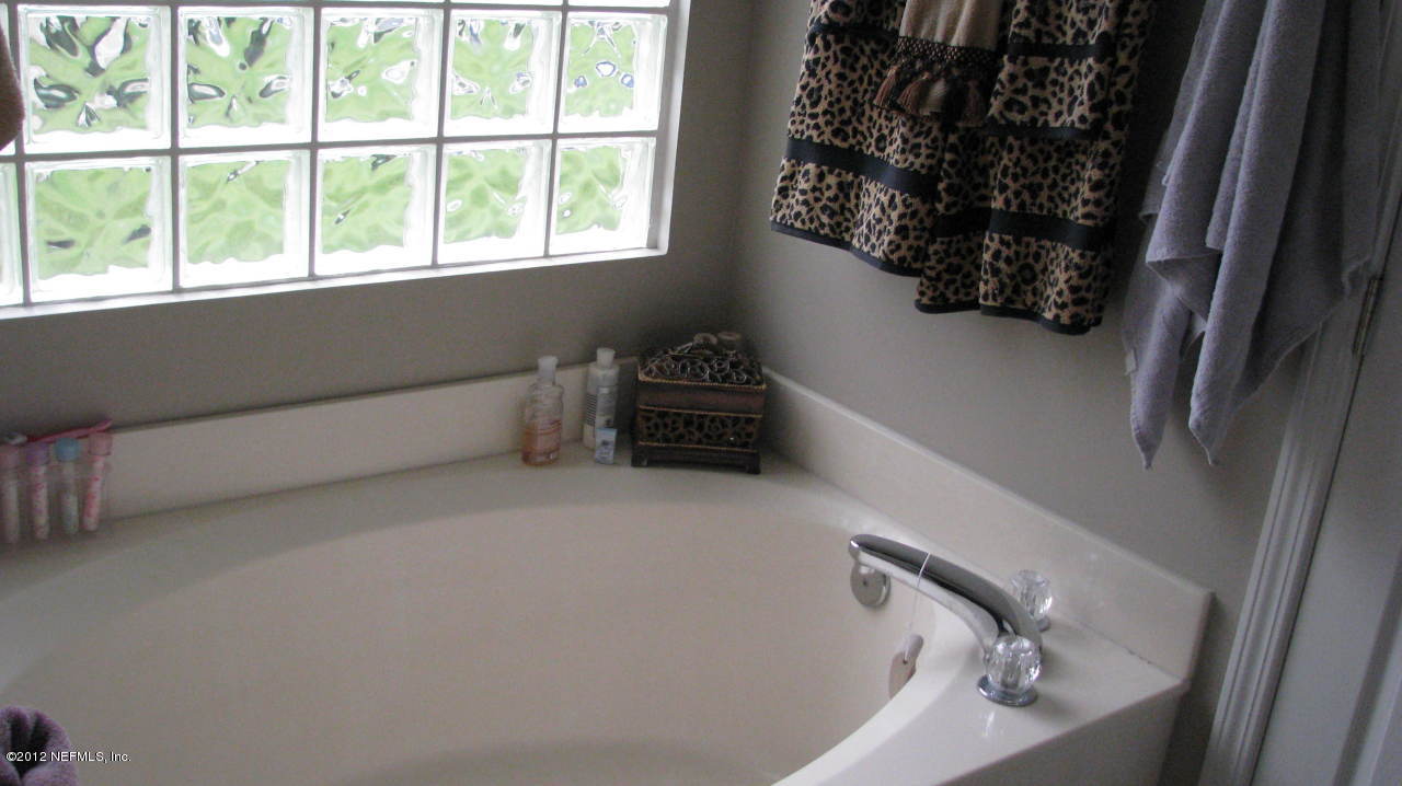 4152 East Ripken Jacksonville, FL 32224 - Photo 6 of 14 a bathroom with a bathtub