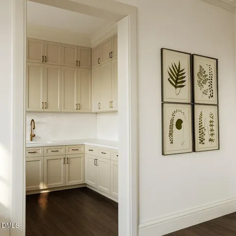 a kitchen with cabinets a sink and appliances