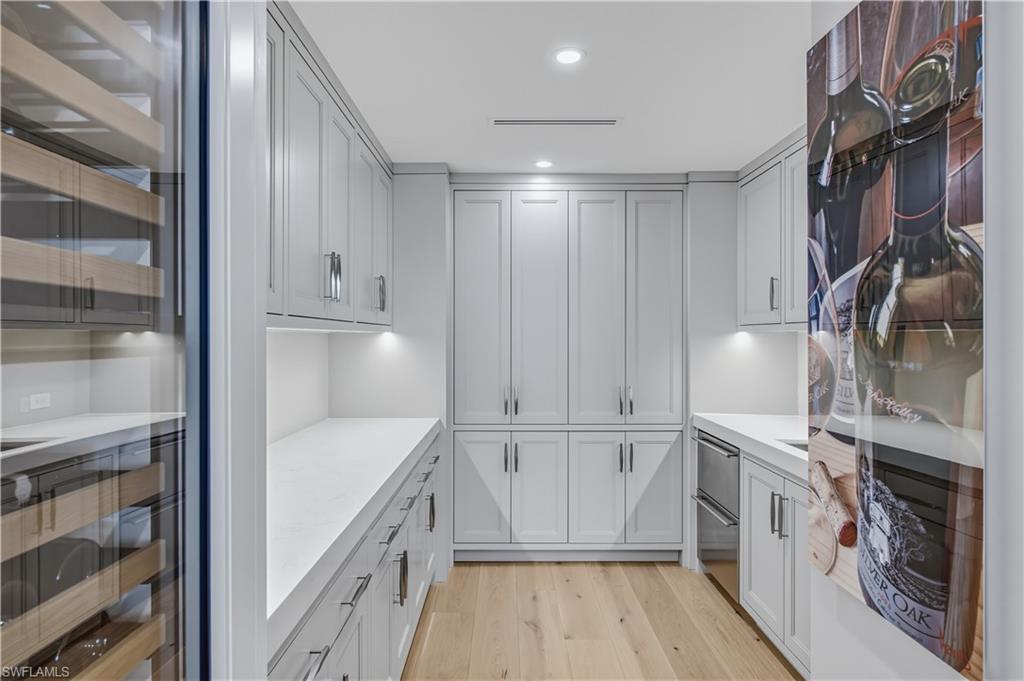 13935 Old Coast Road, Unit 1604 Naples, FL 34110 - Photo 12 of 39 Butler's Pantry Custom Built In Cabinetry and Subzero Wine Cooler