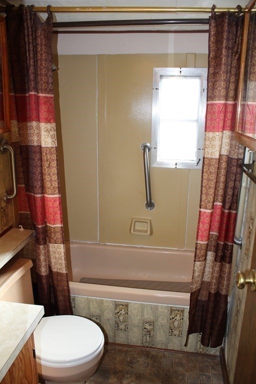 69 Mobile Home Way Springfield, MA 01119 - Photo 17 of 42 a bathroom with a toilet and a shower